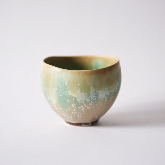Deep footed bowl graded from cream at the rim to soft sea green around its lower body.