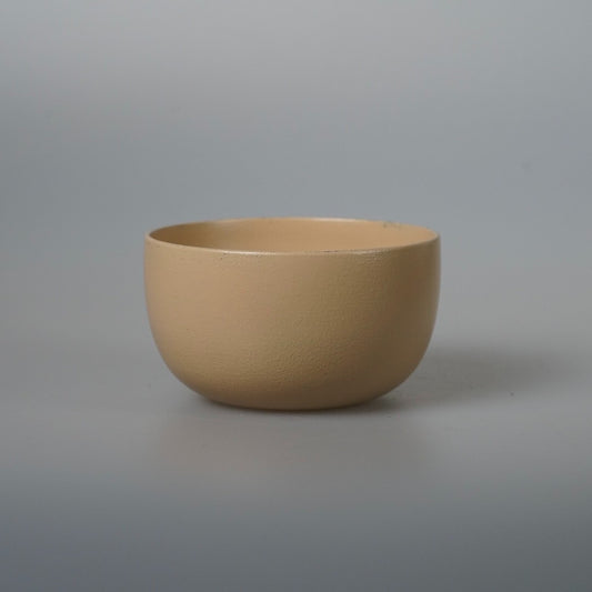 Wide wooden bowl finished in soft matte cream lacquer, with straight tapering sides.