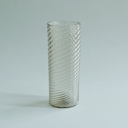 Slim tall clear glass with a close spiral rib pattern running its full height.