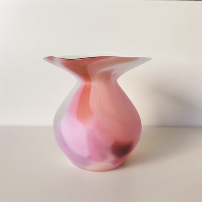 Hand-blown glass vase with a wide flared lip, graduating from soft pink at the base to white at the rim.