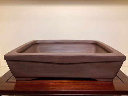 Dark brown rectangular ceramic pot with matte finish and slightly raised rim.
