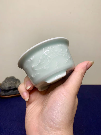 Ito Tuniyo Blue-Green Glazed Relief-Carved Fish-Playing Pot