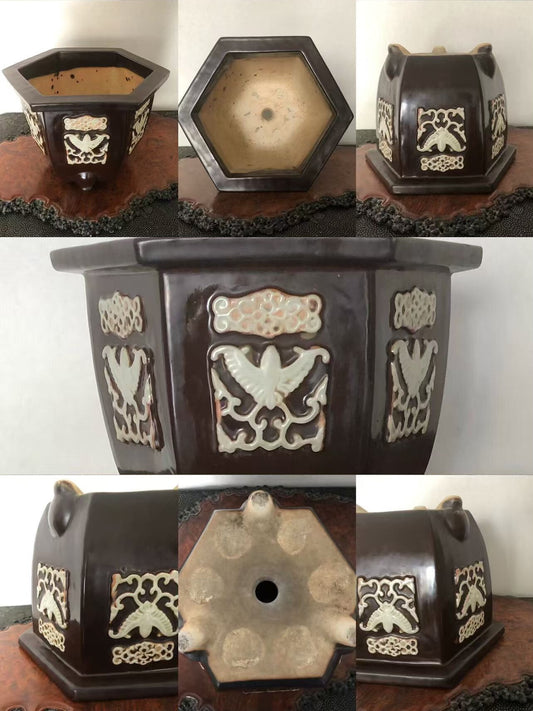 Dark brown hexagonal pot with cream-colored bird and floral relief decorations.