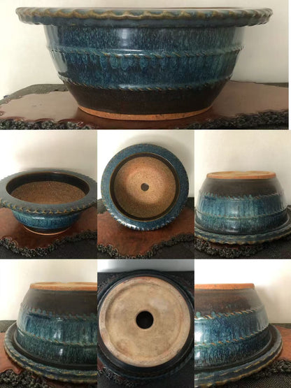A glazed blue ceramic pot with a scalloped rim and textured surface.