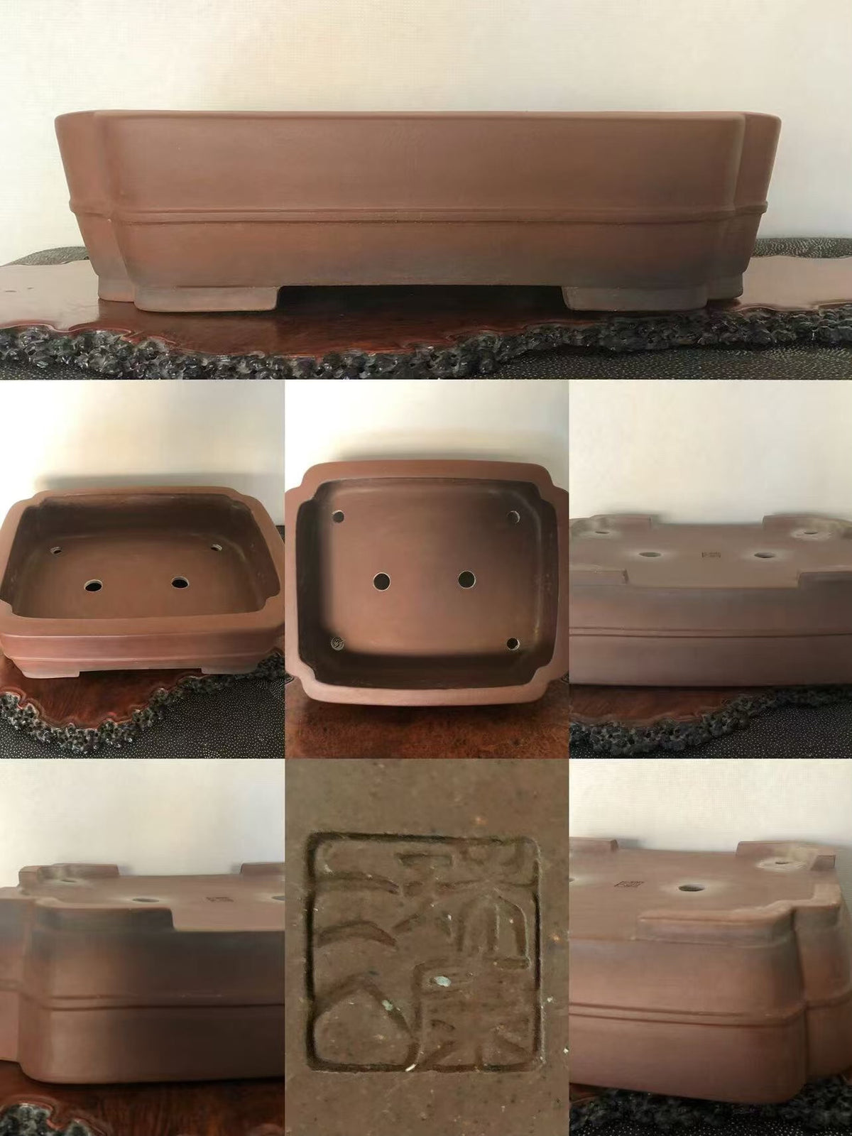 A rectangular brown unglazed clay pot with a stamped square mark and drainage holes.