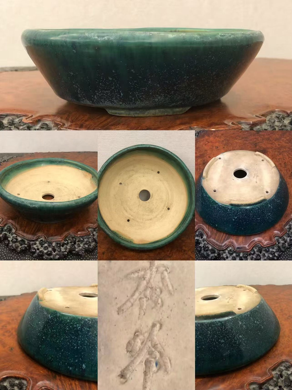 Dark green glazed pot with speckles, shallow bowl shape, and carved characters on base.