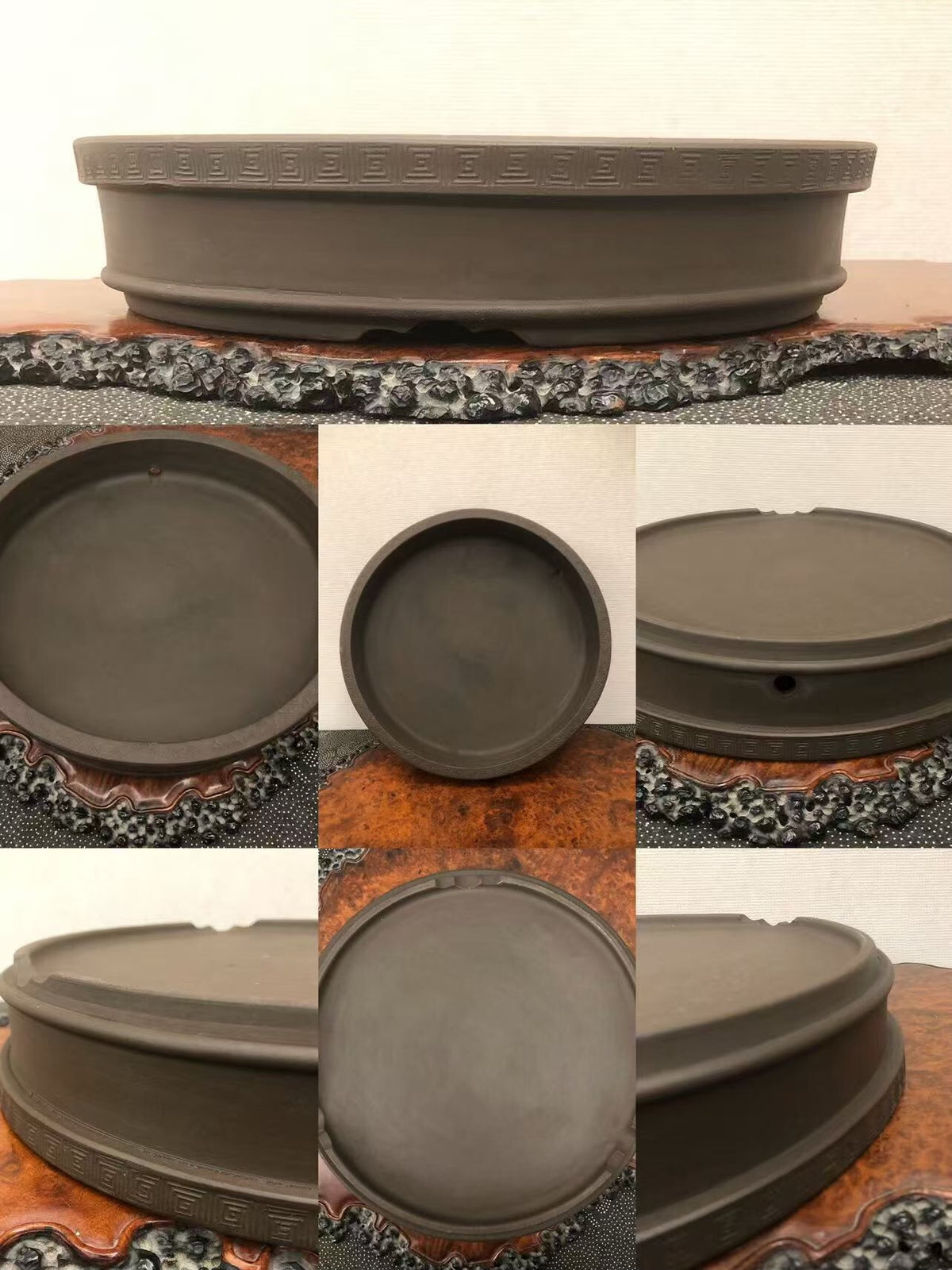Dark grey unglazed ceramic bonsai pot with incised geometric pattern around rim.