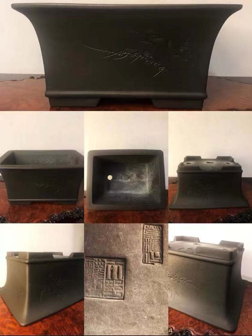 Dark grey glazed rectangular pot with carved characters and a square seal mark.