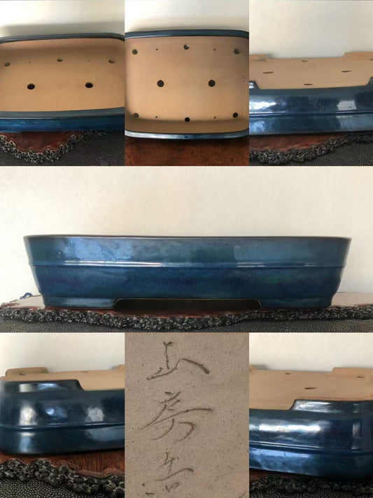 Dark blue glazed square pot with unglazed beige interior, six drainage holes, and faint Japanese characters.