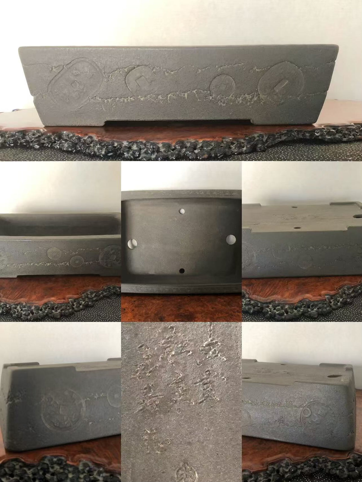 Dark grey rectangular pot with embossed circular patterns and engraved characters on its surface.