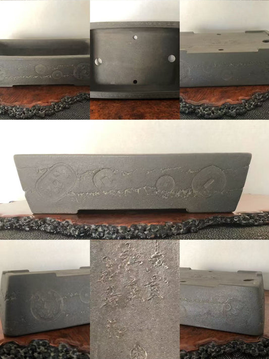 Dark grey rectangular pot with embossed circular patterns and engraved characters on its surface.