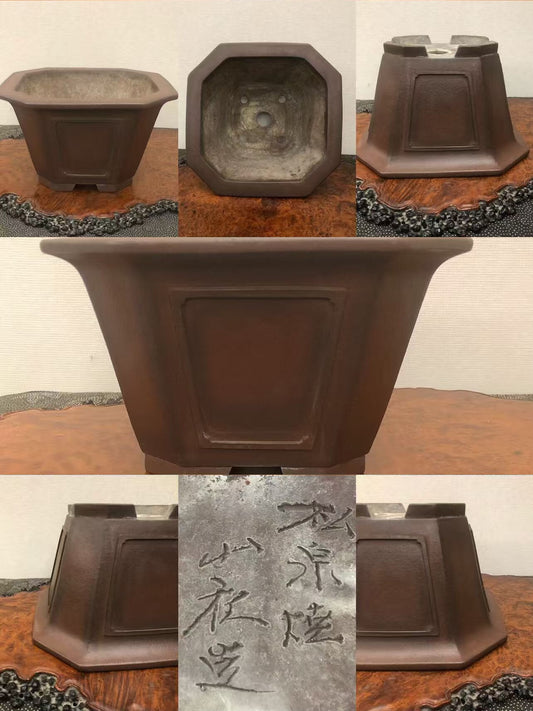 Dark brown octagonal ceramic pot with matte finish and incised characters on base.