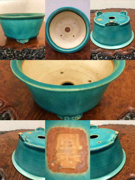Turquoise glazed ceramic bonsai pot with three feet and a brown stamped mark.