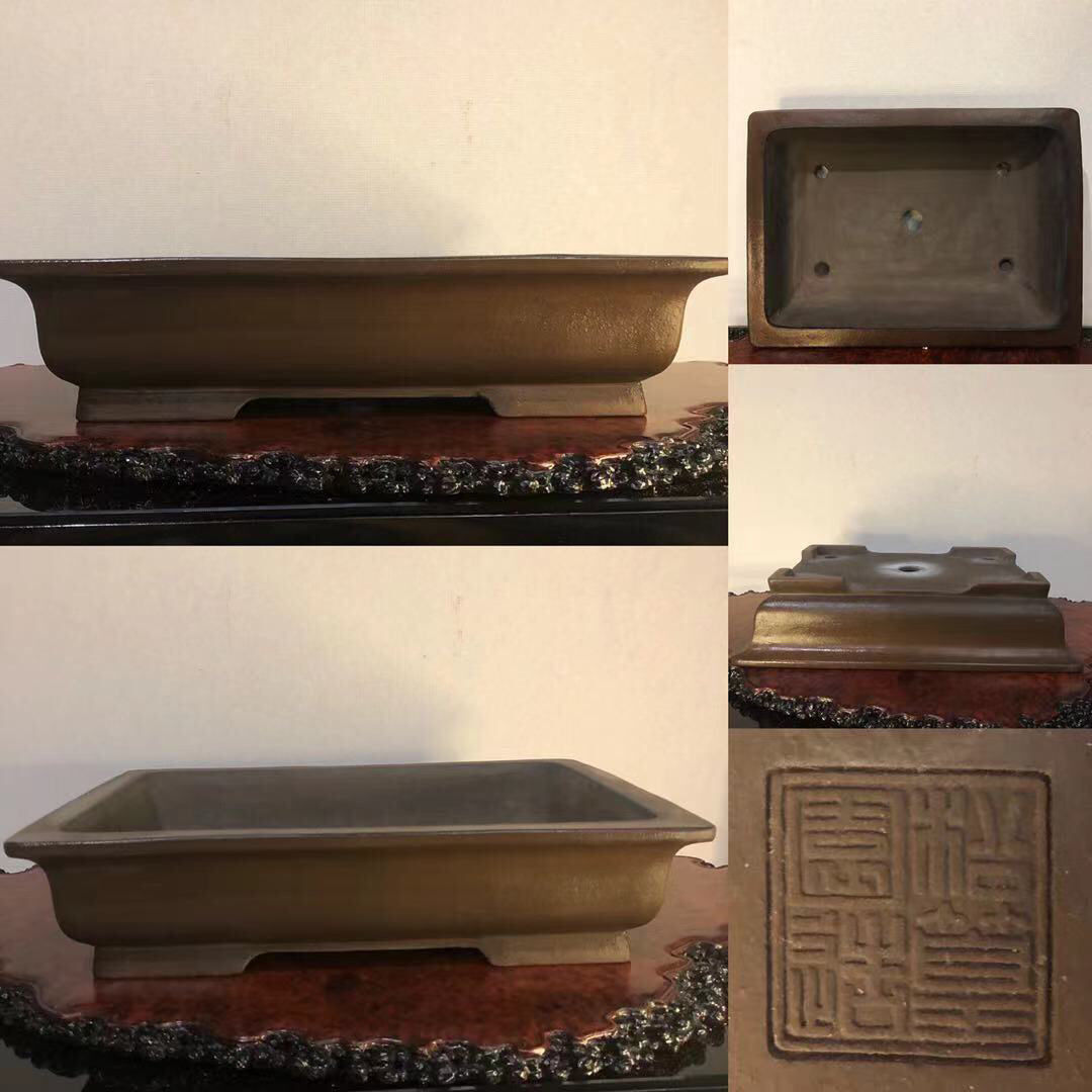 Rectangular glazed brown ceramic bonsai pot with raised base and stamped square mark.
