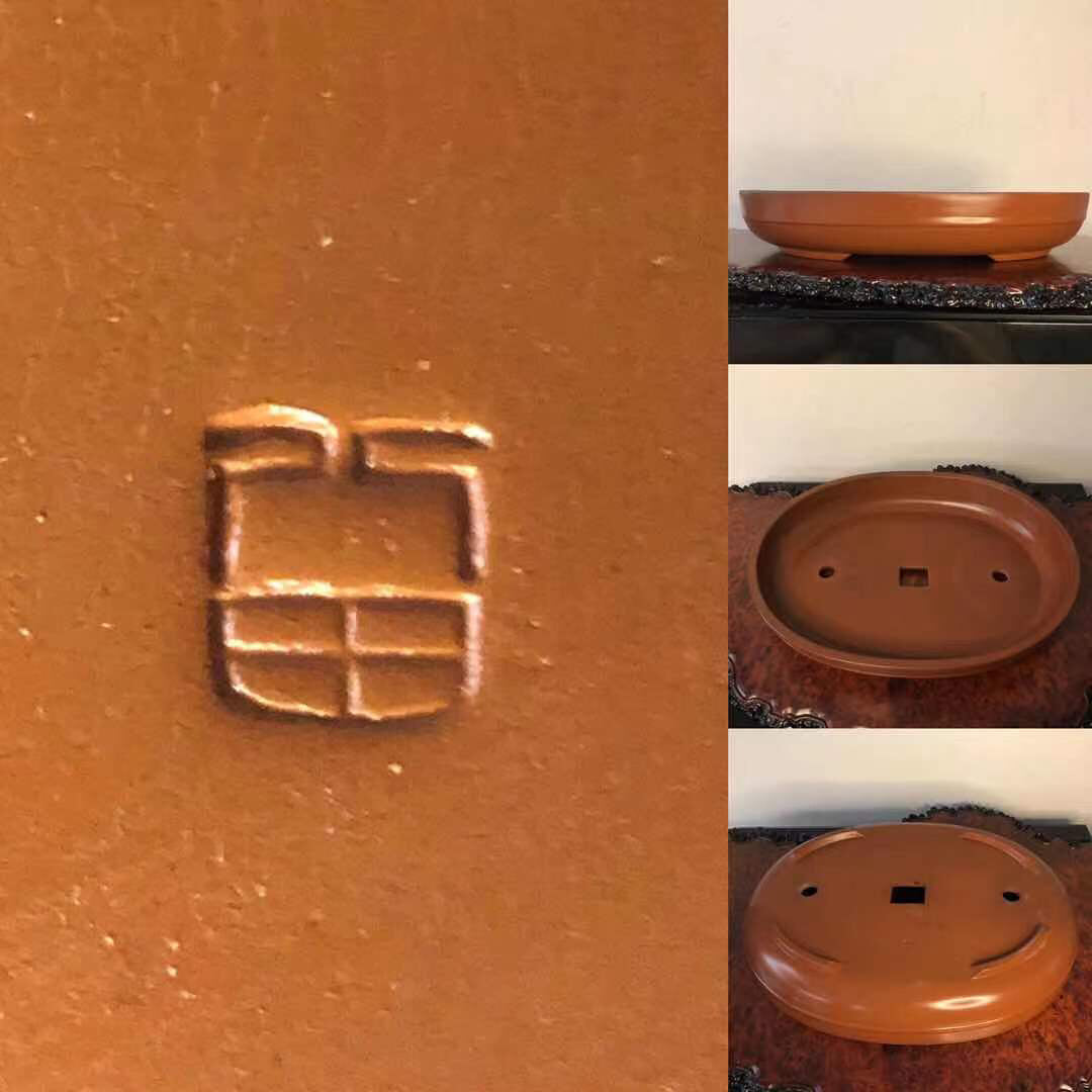 A terracotta bonsai pot with a matte finish, featuring a square mark and drainage holes.