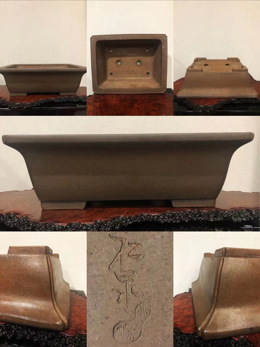 A matte brown ceramic bonsai pot with a rectangular base and incised character markings.