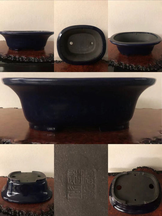 Dark blue glazed ceramic bonsai pot with square base and two drainage holes.