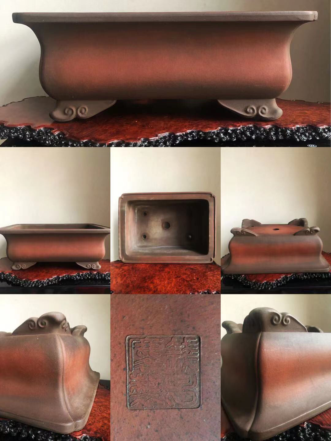 A reddish-brown glazed rectangular pot with four ornate feet and an embossed square seal on its base.