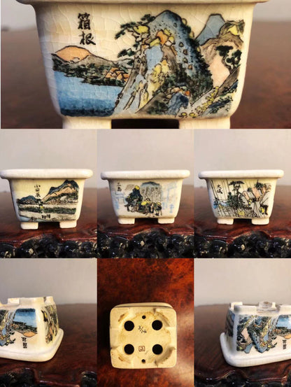 Five small white glazed pots, each with hand-painted landscape scenes and Japanese characters.