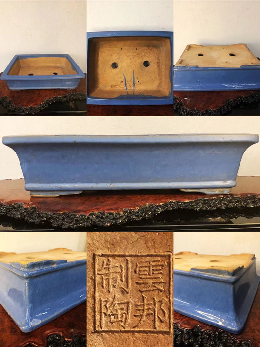 A rectangular blue glazed pot with a stamped square mark and two drainage holes.