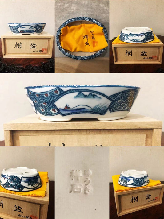 A small blue and white ceramic bonsai pot with mountain and boat design, shown from multiple angles.
