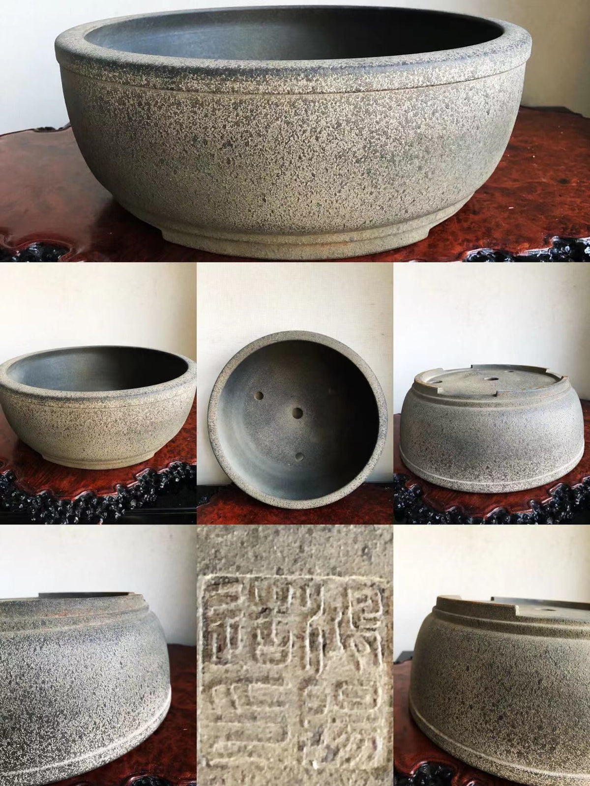 A speckled grey glazed pot with a wide rim and carved seal mark.