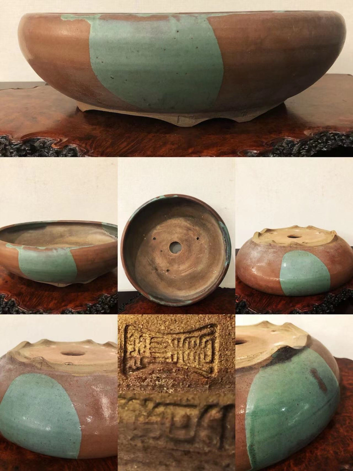 A round ceramic pot with brown and green glazed sections and a stamped mark on its base.