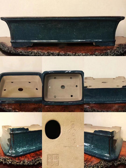 Dark teal glazed rectangular pot with matte interior, one circular hole and four smaller holes.