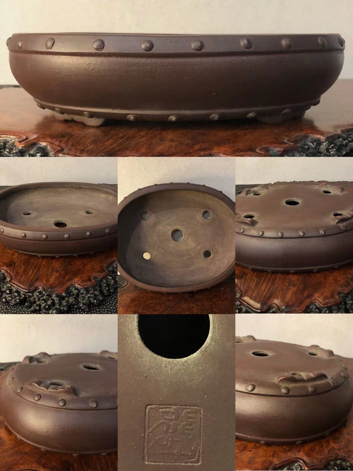 Dark brown glazed pot with rivet-like bumps around rim and three drainage holes on base.