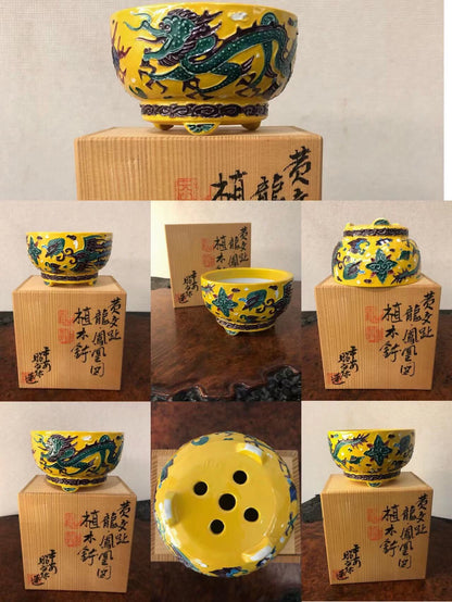 A yellow glazed pot with a green dragon design, shown from multiple angles.