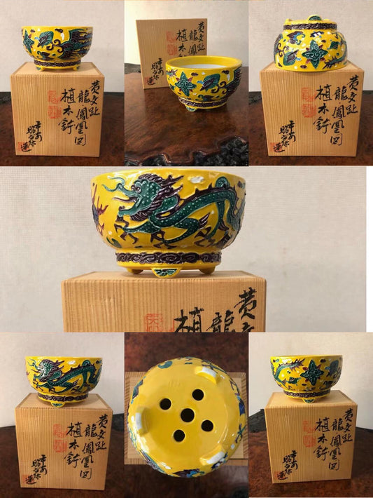 A yellow glazed pot with a green dragon design, shown from multiple angles.