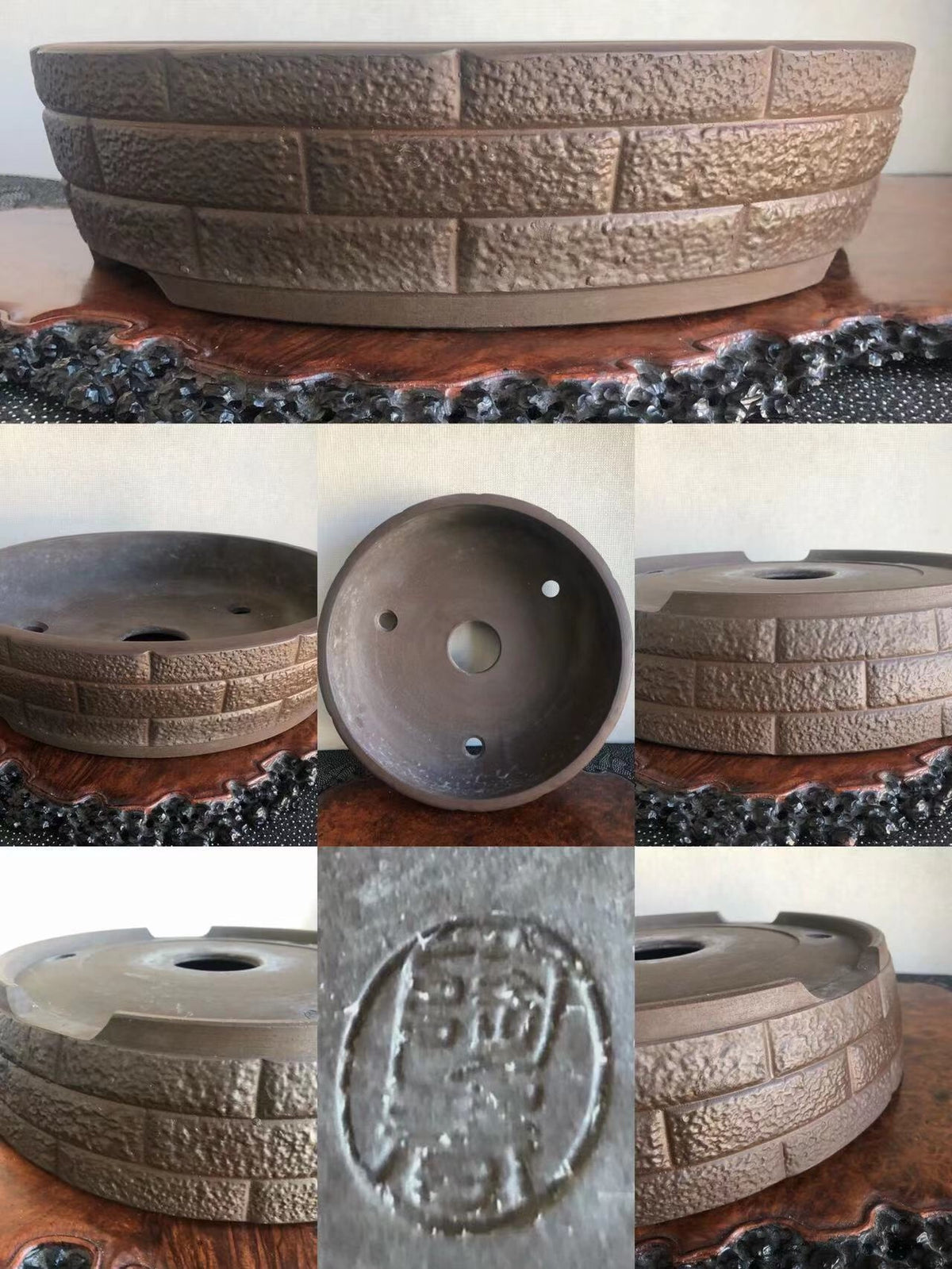A single brown glazed pot with a brick-patterned texture and a stamped seal on its base.