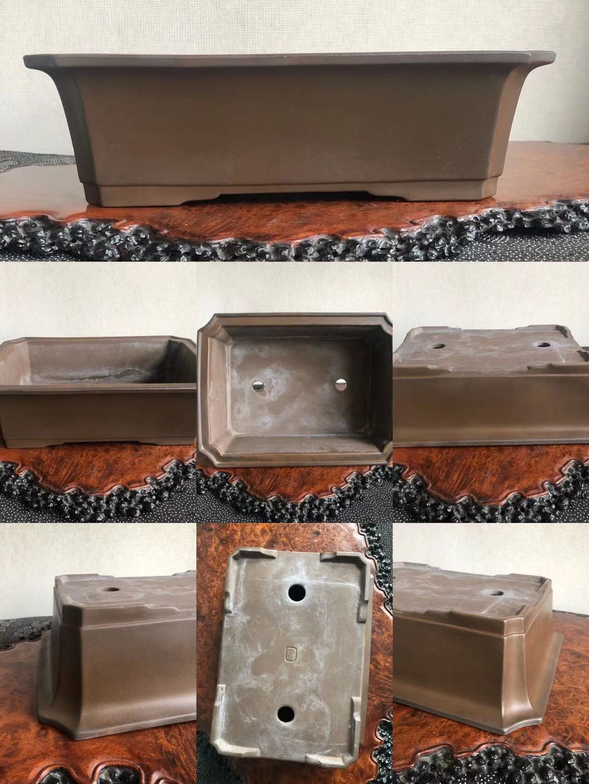 A dark brown, rectangular ceramic bonsai pot with a matte finish and two drainage holes.