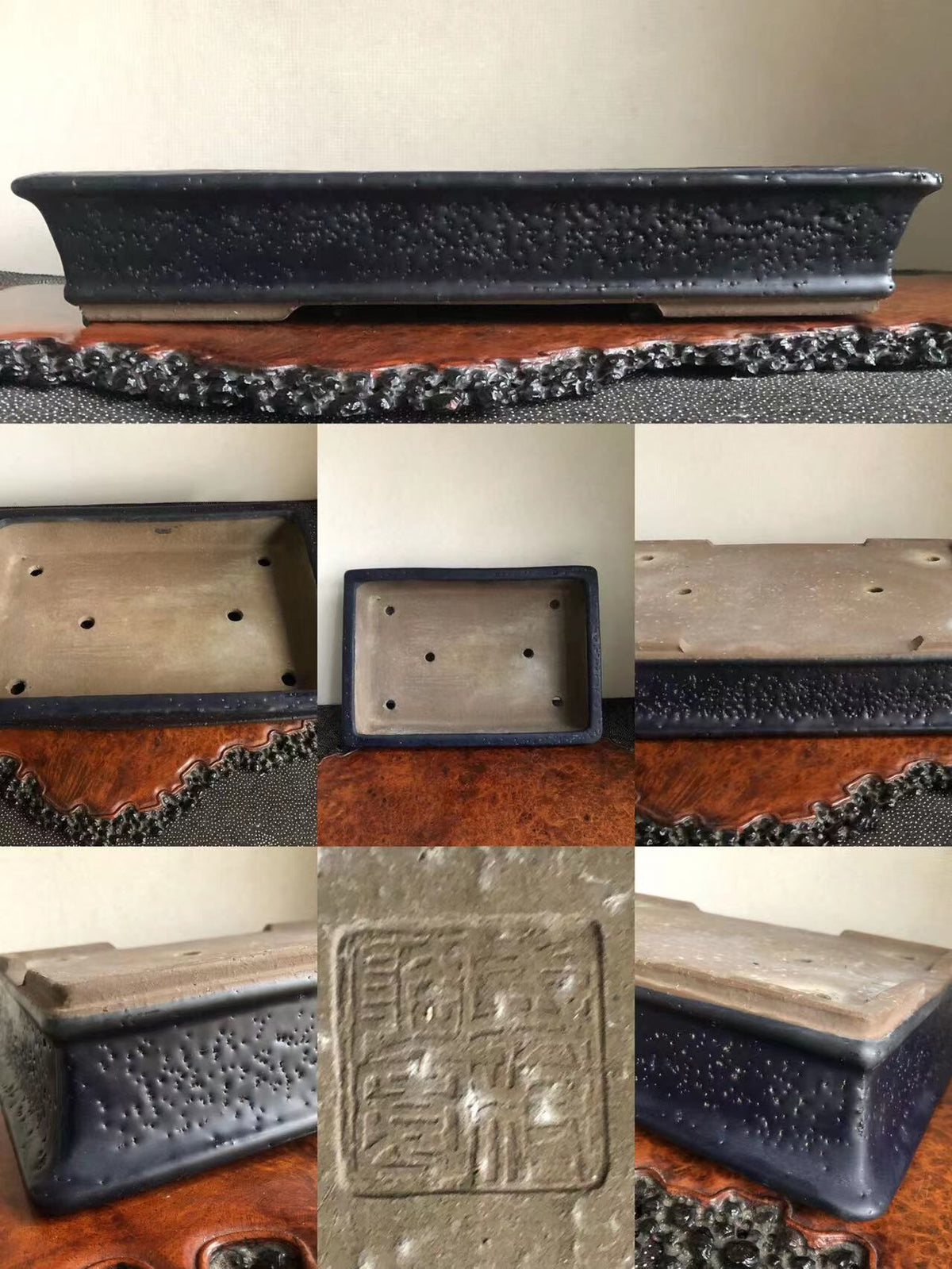 Rectangular dark glazed pot with textured surface and stamped square mark on base.
