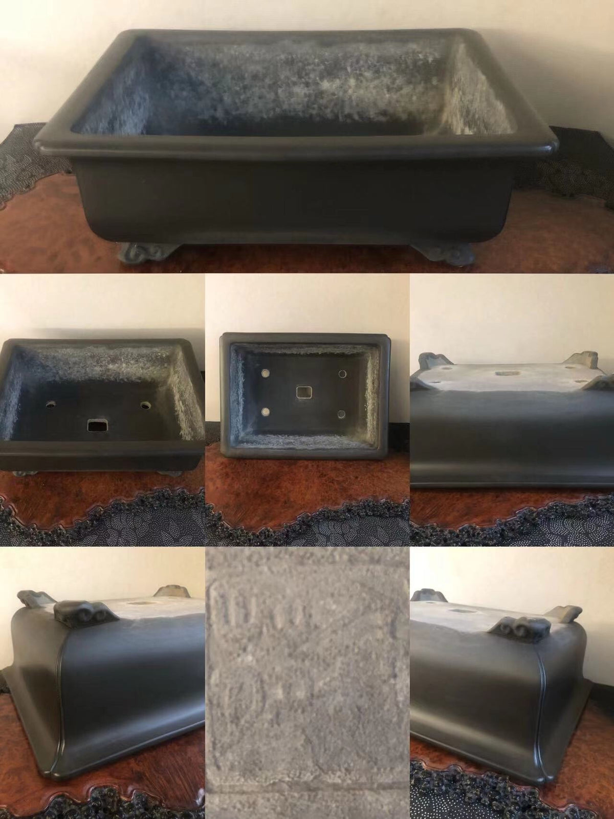 Dark grey rectangular pot with textured glaze, four feet, and engraved markings on base.