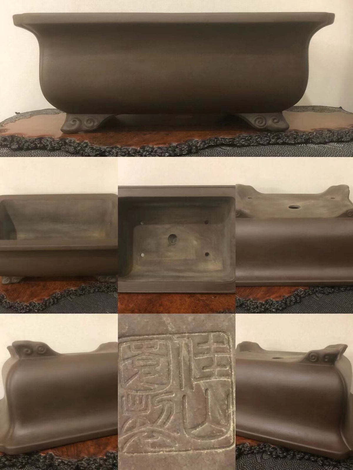 Dark brown glazed rectangular pot with carved character marks and four ornate feet.