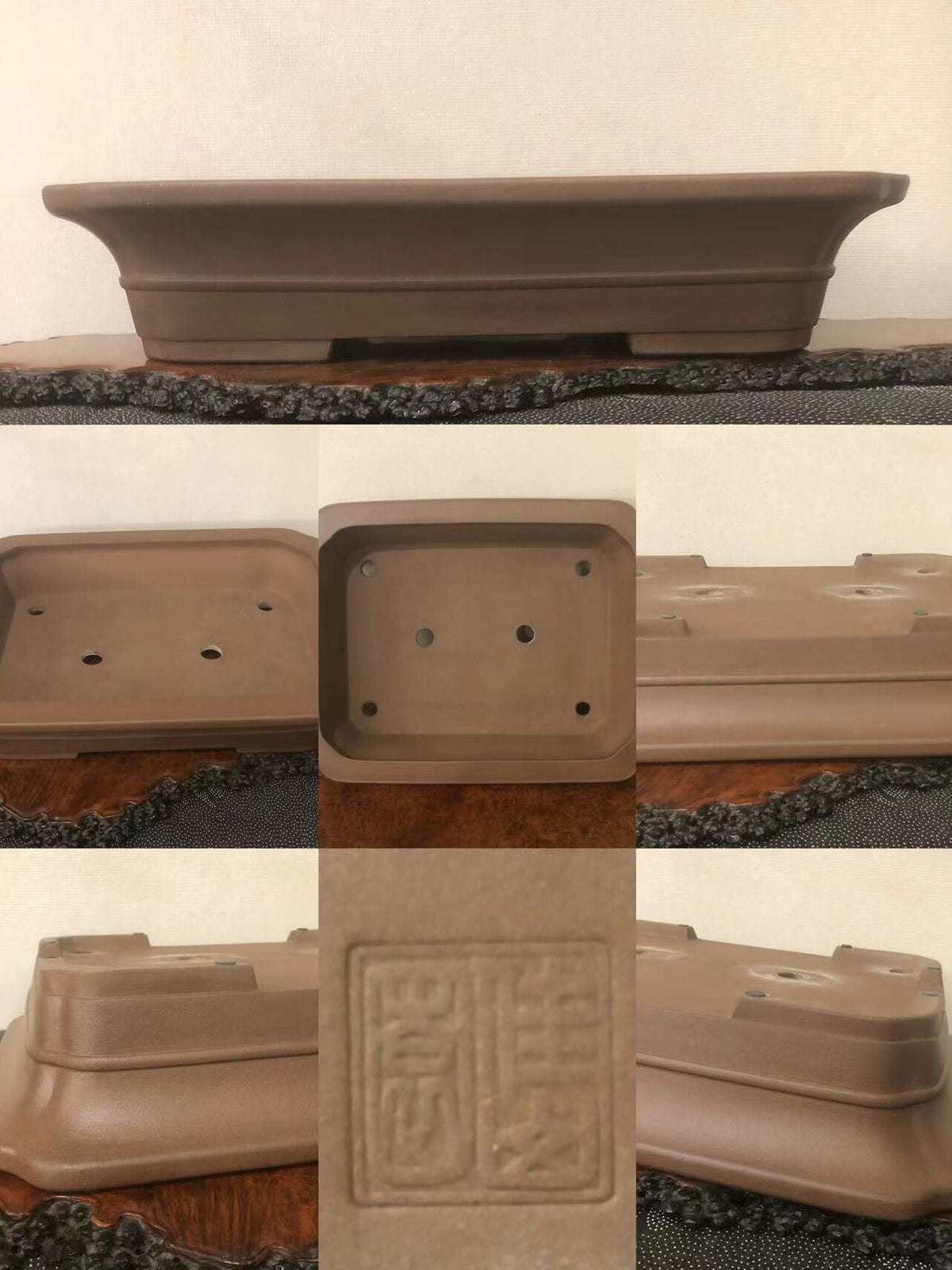 A brown unglazed rectangular bonsai pot with a stamped square mark on its base.