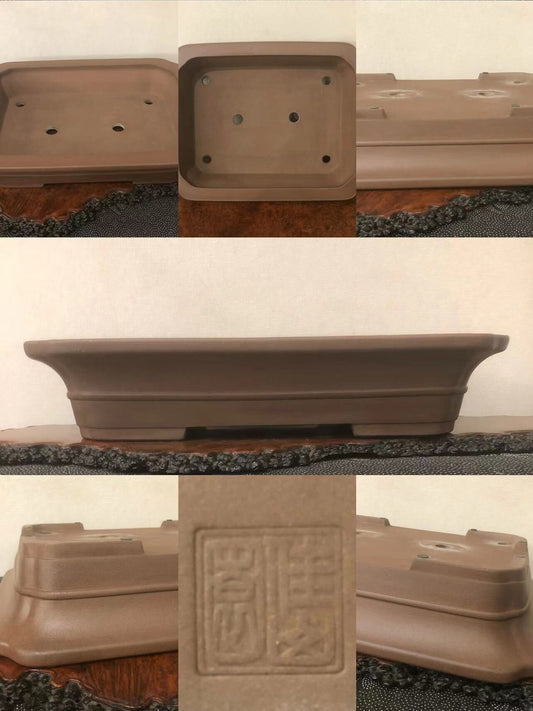 A brown unglazed rectangular bonsai pot with a stamped square mark on its base.