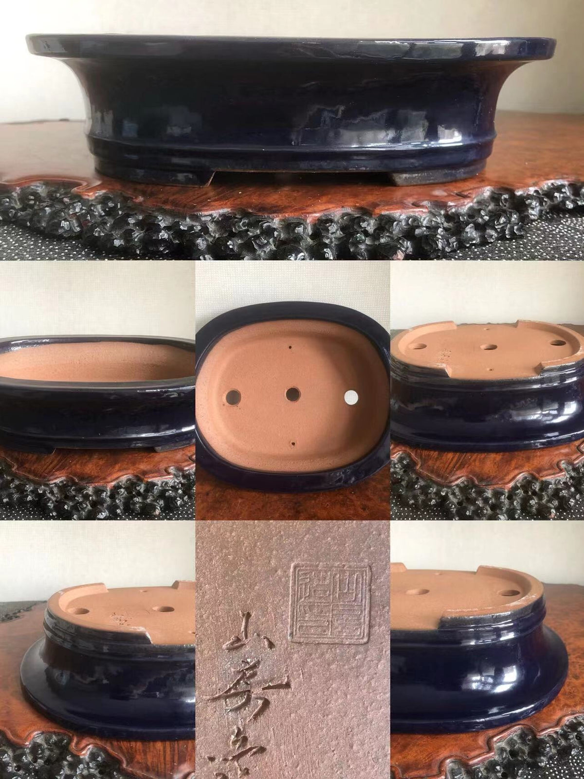 Dark blue glazed pot with three drainage holes and a square maker's mark on the base.