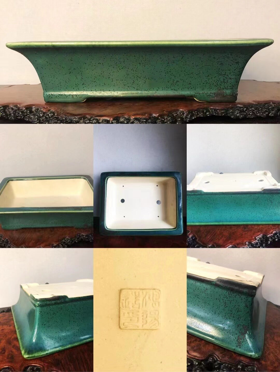 A green speckled glazed rectangular pot with a cream interior and a square maker's mark.