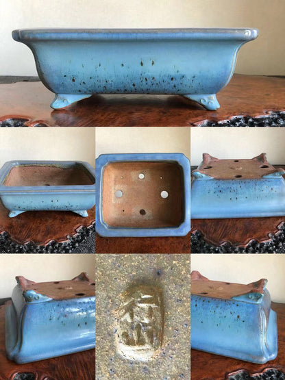 Light blue glazed rectangular pot with speckles, four feet, and an impressed seal.