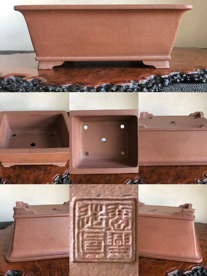 Rectangular terracotta bonsai pot with unglazed matte finish and raised base, showing maker's seal.