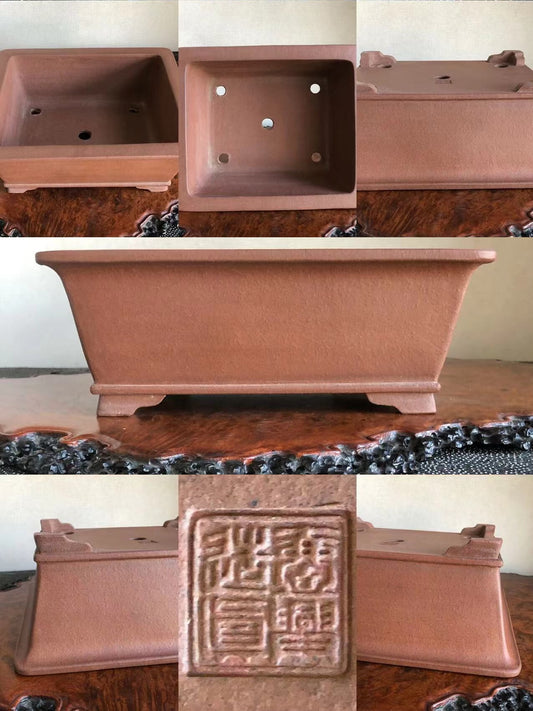 Rectangular terracotta bonsai pot with unglazed matte finish and raised base, showing maker's seal.