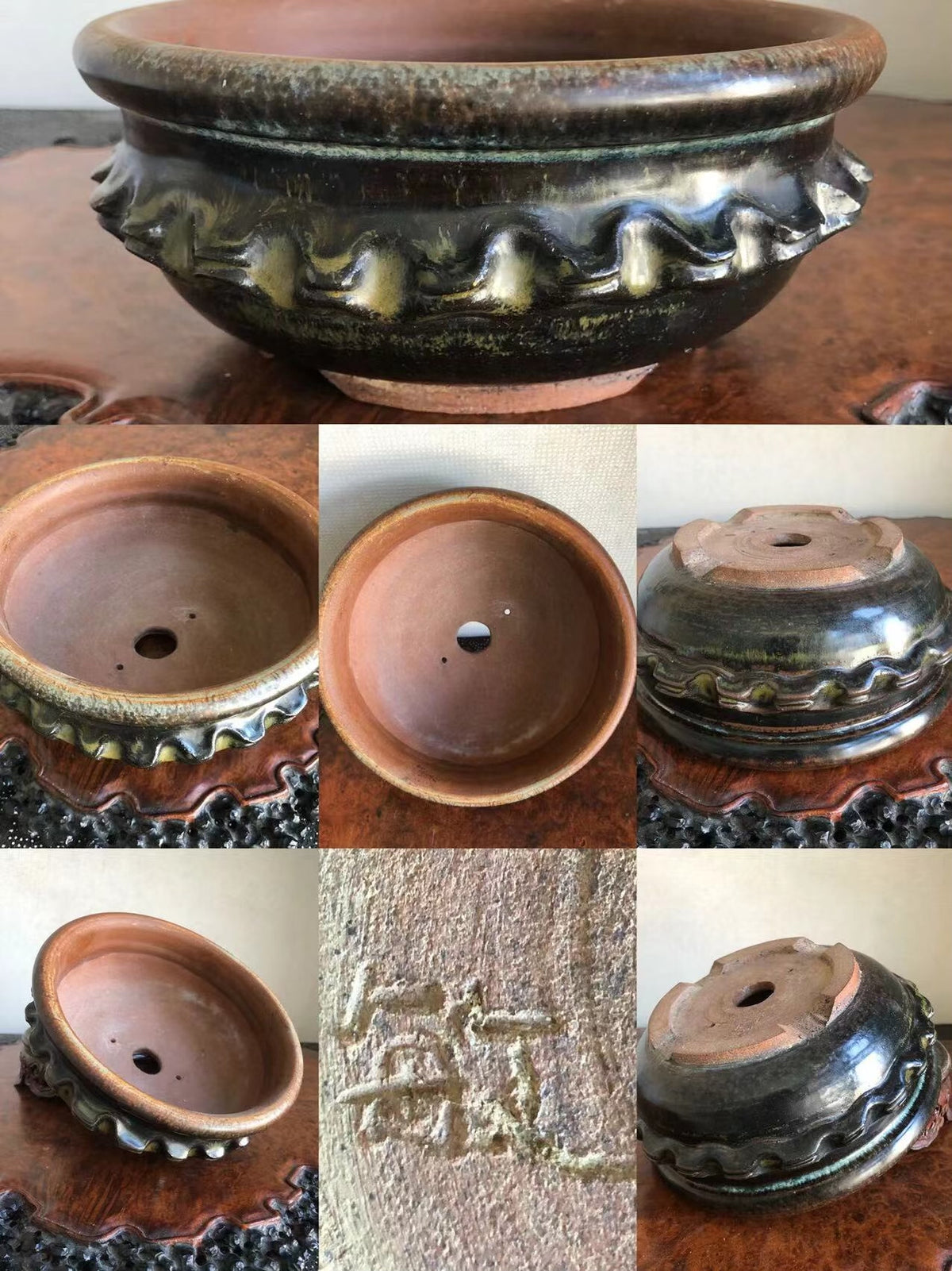 Dark glazed pot with scalloped rim, showing interior, base, and maker's mark.