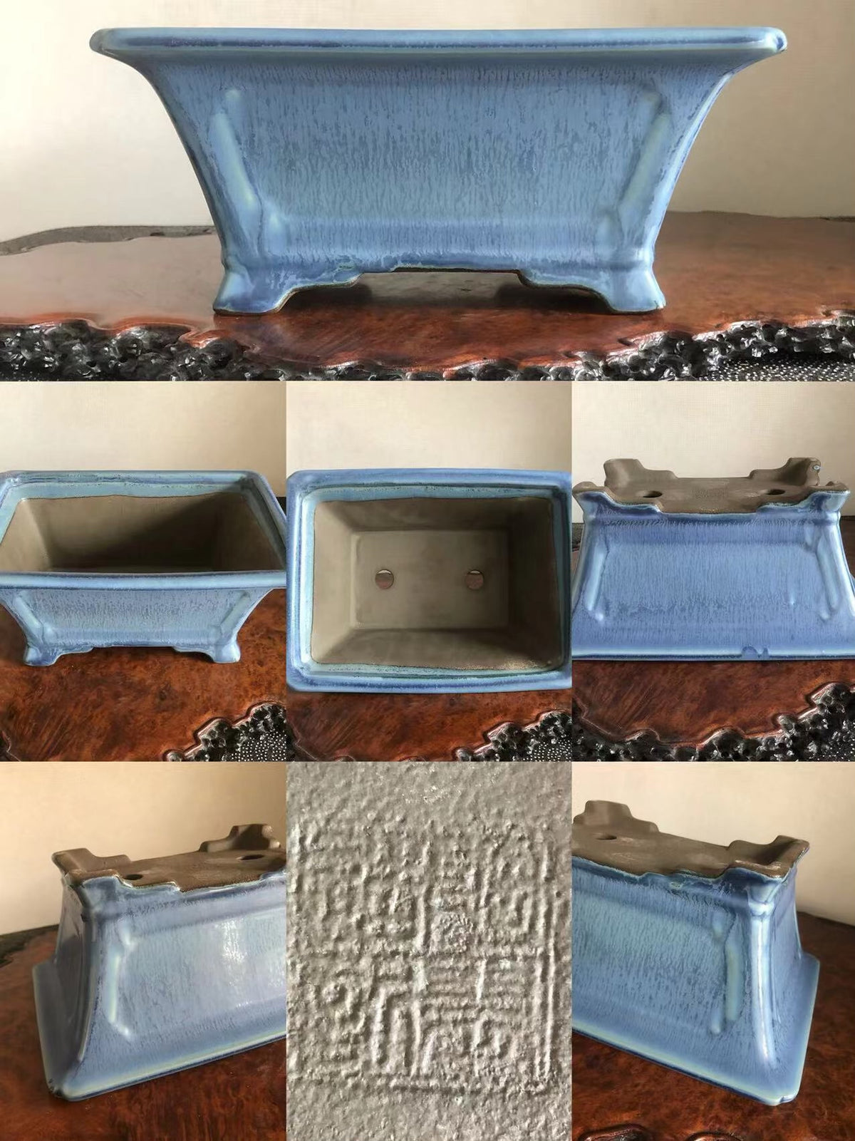 A light blue glazed rectangular pot with a textured surface and a stamped mark on its base.