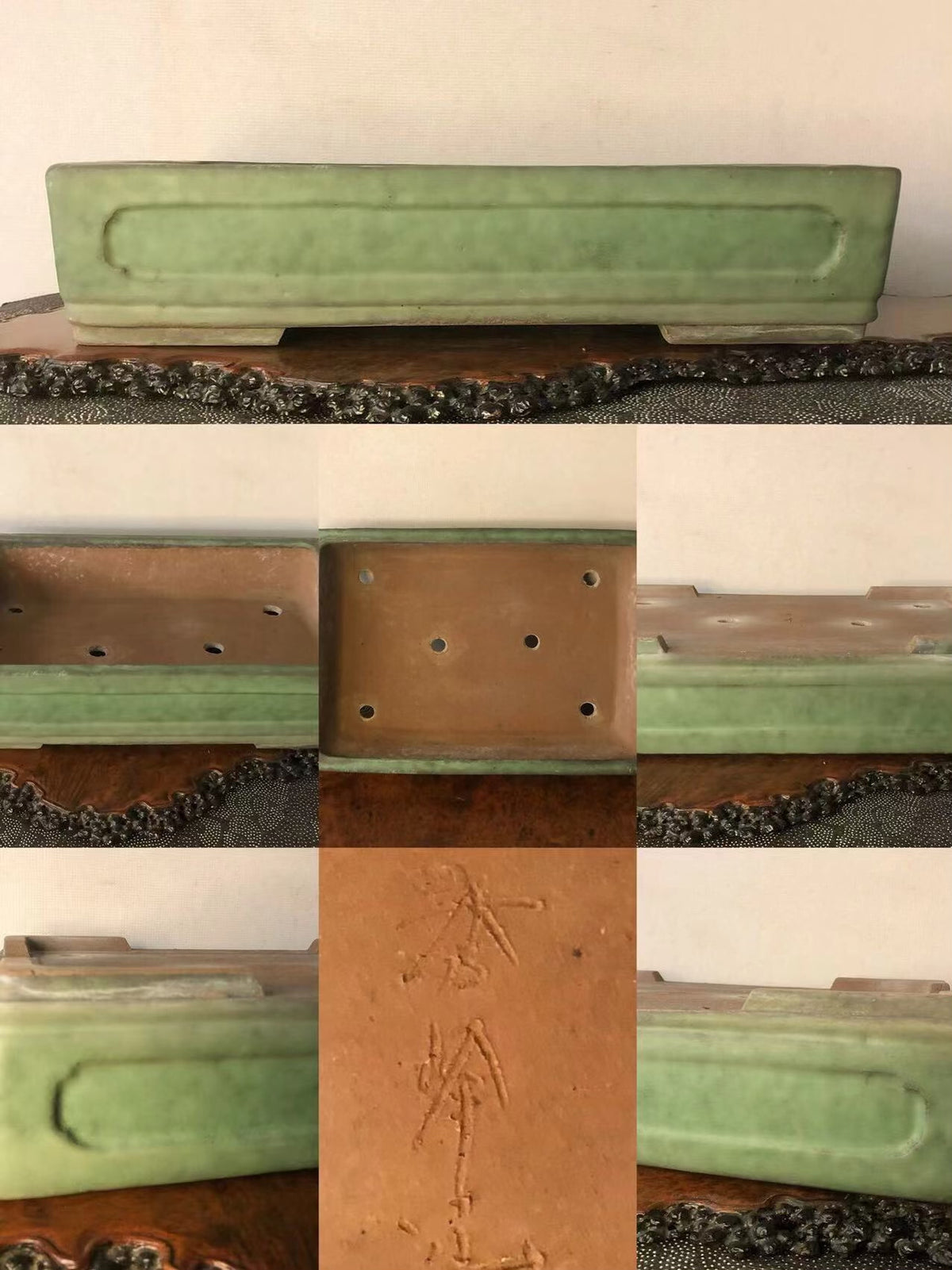 Rectangular green glazed pot with carved characters and drainage holes on base.