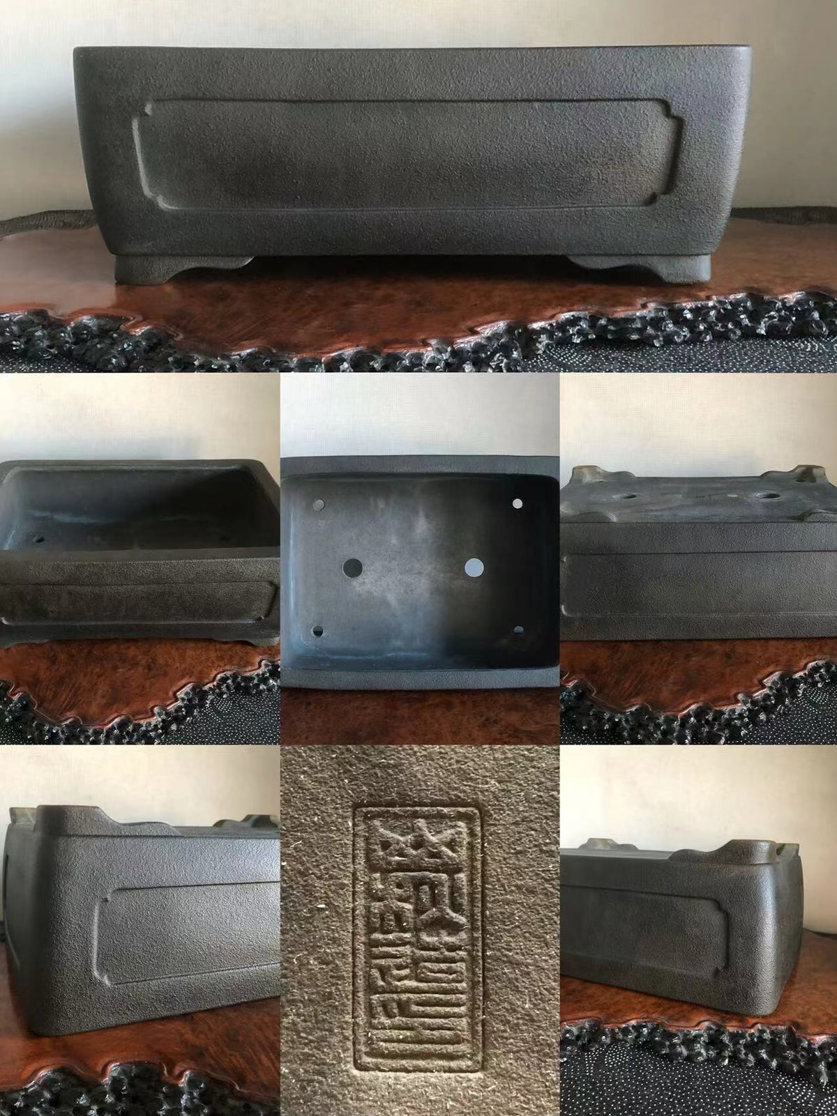 Dark grey rectangular pot with textured matte surface and raised central panel, unglazed.