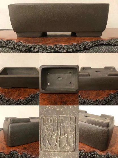 Dark grey rectangular pot with textured matte finish and carved seal on base.