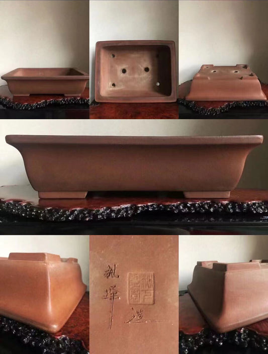 Rectangular terracotta bonsai pot with unglazed matte finish and carved maker's mark.