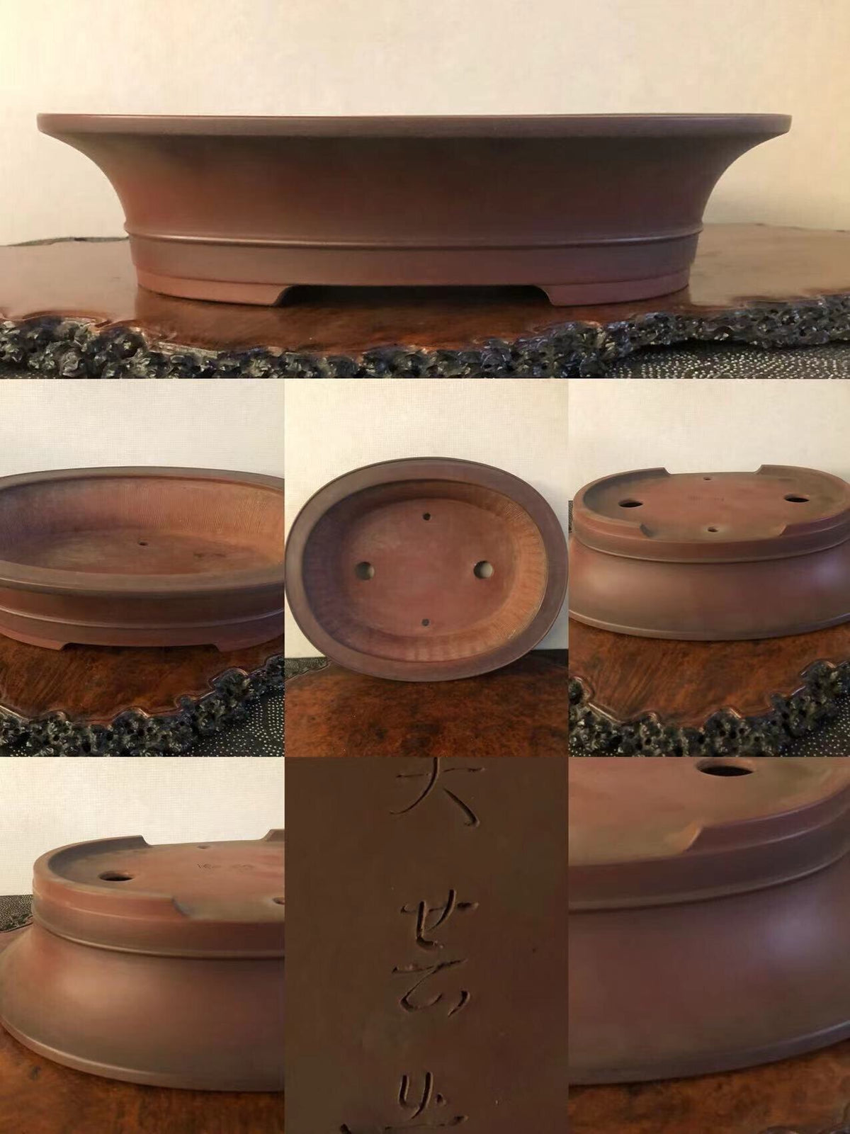 A dark brown, shallow, oval bonsai pot with a matte finish and three drainage holes.